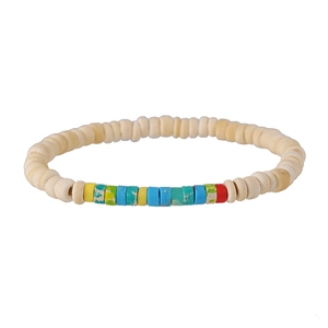 Close-up of bohemian beaded bracelet with coconut shell and colorful imperial stones