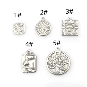 Set de cinco colgantes de acero inoxidable con árbol de la vida y relieve para joyería DIY