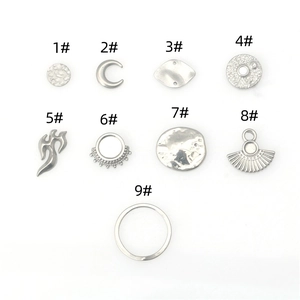 Collection of nine polished stainless steel charms for hip-hop DIY jewelry making