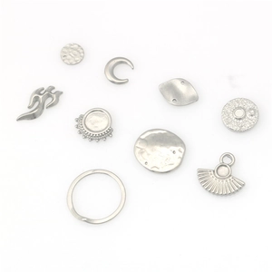 Set of silver stainless steel charms featuring moon, fan, and textured circle pendants