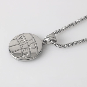 Macro shot of silver stainless steel volleyball pendant featuring I Love Volleyball engraving