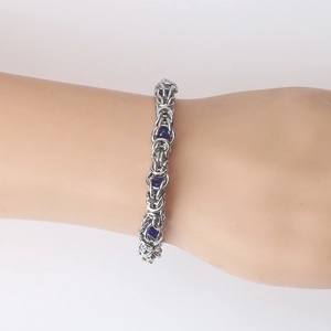 Handcrafted stainless steel bracelet with blue beads and woven Byzantine chain link style