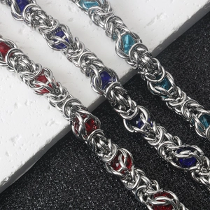 Detail of handcrafted Byzantine steel bracelets with red and blue bead inserts