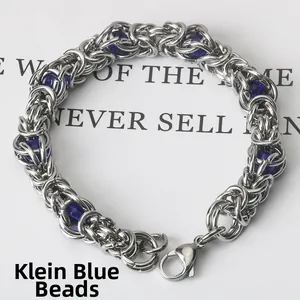 Detailed macro view of Byzantine chain bracelet with Klein blue beads and lobster clasp