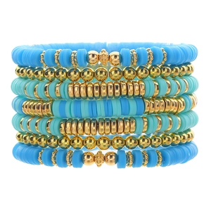 7-piece bohemian stackable bead bracelet set with turquoise clay heishi and gold beads