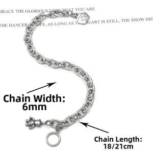Detail of stainless steel O-chain bracelet with bear charm, heart pendant, and OT clasp