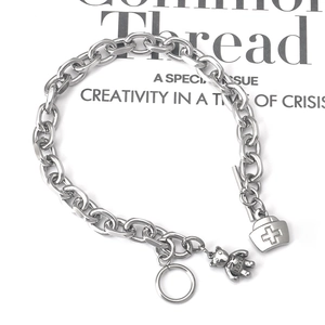 Silver stainless steel OT buckle bracelet with bear and nurse hat charms on a flat chain
