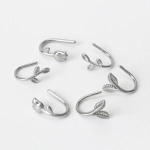 Elegant silver tulip leaf earring set featuring minimalist floral designs on white background