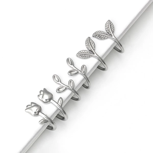 Minimalist silver tulip and leaf ring set featuring six pieces with polished metal finish