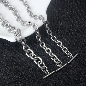 Three sizes of silver stainless steel OT buckle link chains displayed on a dark background