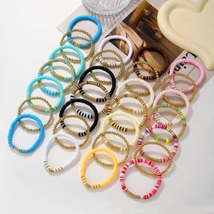 Bohemian colorful Heishi clay bead bracelet set with gold accents for summer beach wear