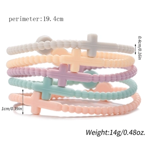 Close-up of five colorful silicone cross bracelets with size measurements and weight info