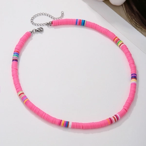 Close-up of bright pink handmade Heishi clay bead necklace with adjustable silver clasp