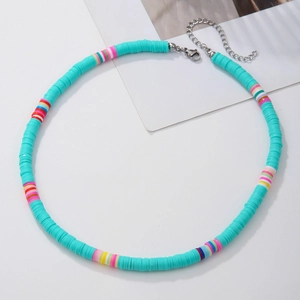 Detail of bohemian turquoise heishi bead necklace with multi-color accents and lobster clasp