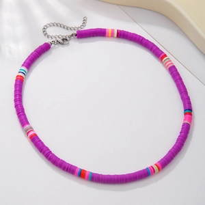 Detailed view of handmade colorful polymer clay bead necklace with silver lobster clasp