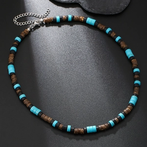 Bohemian punk necklace with turquoise and wood beads on a dark textured surface