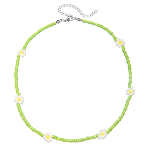 Bohemian light green seed bead necklace with white daisy accents and metal clasp