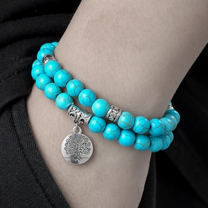 Double-layer 8mm turquoise bead bracelet featuring a silver Tree of Life charm pendant