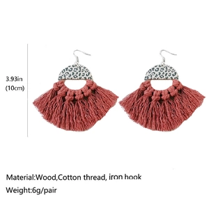 Detail view showing dimensions of bohemian leopard print wood and tassel fan earrings