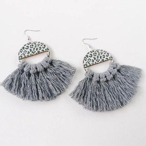 Bohemian fan-shaped earrings with leopard print and grey tassel fringe on white background