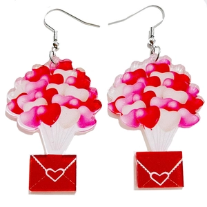 Detail of acrylic Valentine heart balloons and red envelope drop earrings on white background