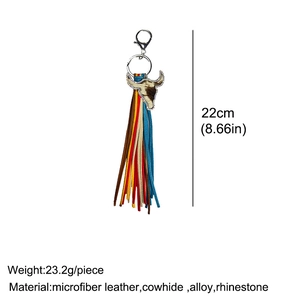 Detail of western bull head keychain with colorful leather tassels and rhinestone edges