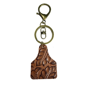 Vintage western cowboy keychain with embossed floral leather tag and bronze metal hardware