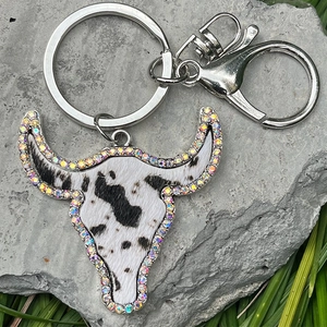Western style cow skull keychain with cowhide texture and colorful rhinestones