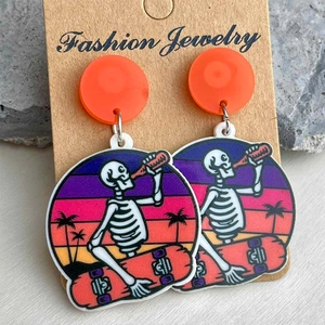 Détails des boucles d'oreilles en acrylique avec motif coucher de soleil et squelette
