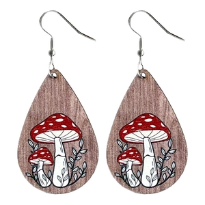 Bohemian teardrop wooden earrings featuring red mushroom and leaf patterns on white background