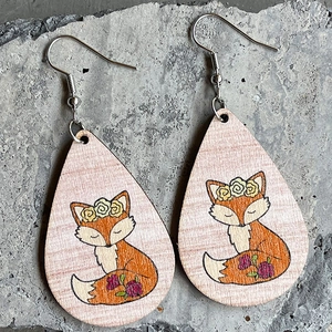 Bohemian teardrop wooden earrings featuring cute orange fox with flower crown on grey stone