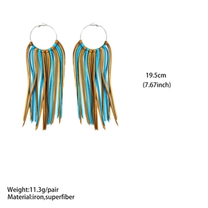 Detail view of 19.5cm long Western style earrings with blue and tan fringe and iron hoops