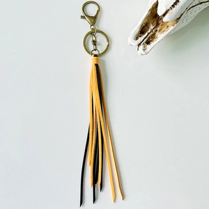 Bohemian long leather fringe keychain in orange and black with vintage bronze metal ring