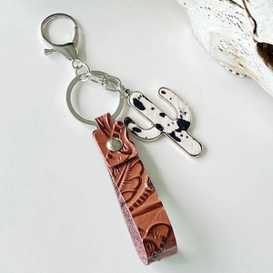 Vintage western leather keychain with cactus cow print pendant and floral embossed wristlet