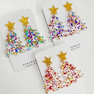 Tres pares de pendientes de árbol de Navidad con estrellas doradas y lentejuelas