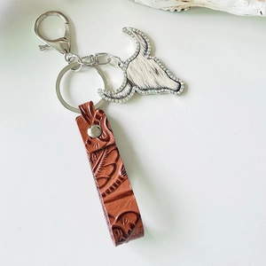 Western cowboy style leather keychain with embossed bull head charm and shiny rhinestones