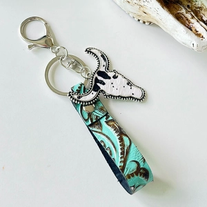 Western vintage leather keychain with cow skull pendant and turquoise floral strap