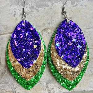 Detailed view of triple-layered glitter earrings in purple, gold, and green sequins