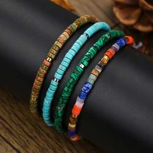 Bohemian beaded bracelets with turquoise and imperial stone on a display stand