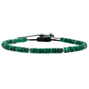 Detail of bohemian turquoise malachite cylinder beads with silver spacers on woven cord