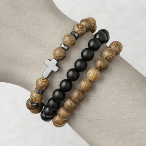Men's 3-piece beaded bracelet set featuring hematite, wood beads, and cross pendant on wrist