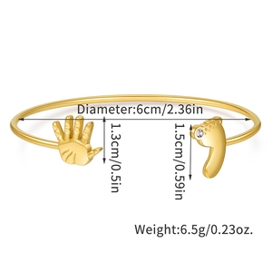 Detailed size specifications of gold open cuff bracelet with baby footprints and zircon