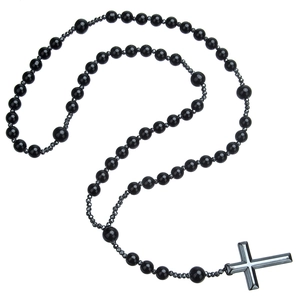 Macro shot of tiger eye and black beads on a religious cross necklace for men