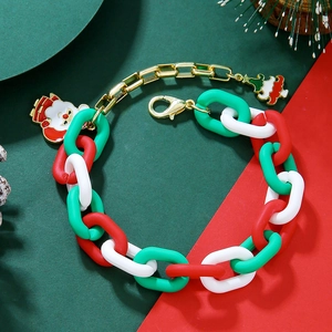 Christmas charm bracelet with Santa Claus and tree pendants on gold link chain