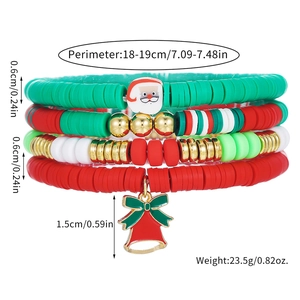 Close-up of four-piece Christmas clay bead bracelets with Santa and red bell charms