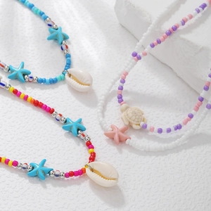 Bohemian multilayer seed bead necklace with starfish, turtle, and natural shell pendants
