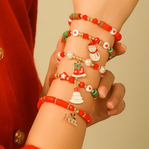Detailed view of five-piece Christmas beaded bracelet set with Noel and snowman charms