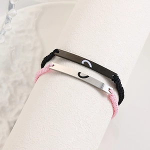 Adjustable woven couple bracelets with polished stainless steel heart charms in black and pink