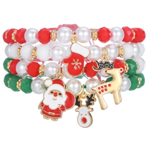 Detailed view of Christmas multilayer beaded bracelets with Santa and reindeer charms