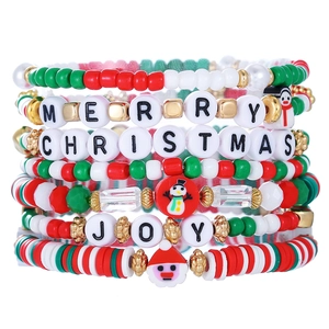 Detail of Christmas beaded bracelet set with snowman and Santa charms for the holidays
